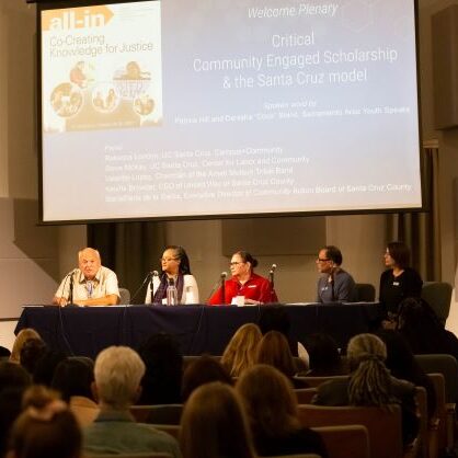 Panelists discussing community-engaged scholarship at the All-In Conference in October 2022.