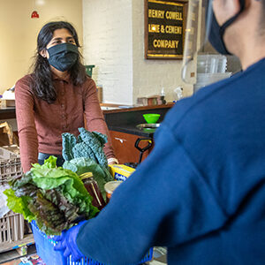 Student picks up groceries at the Redwood Free Market.