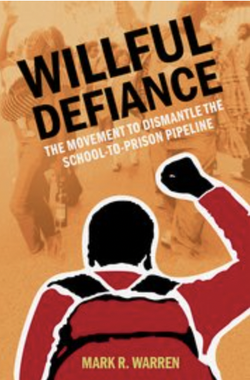 willful defiance book cover featuring person holding their fist up wearing a backpack