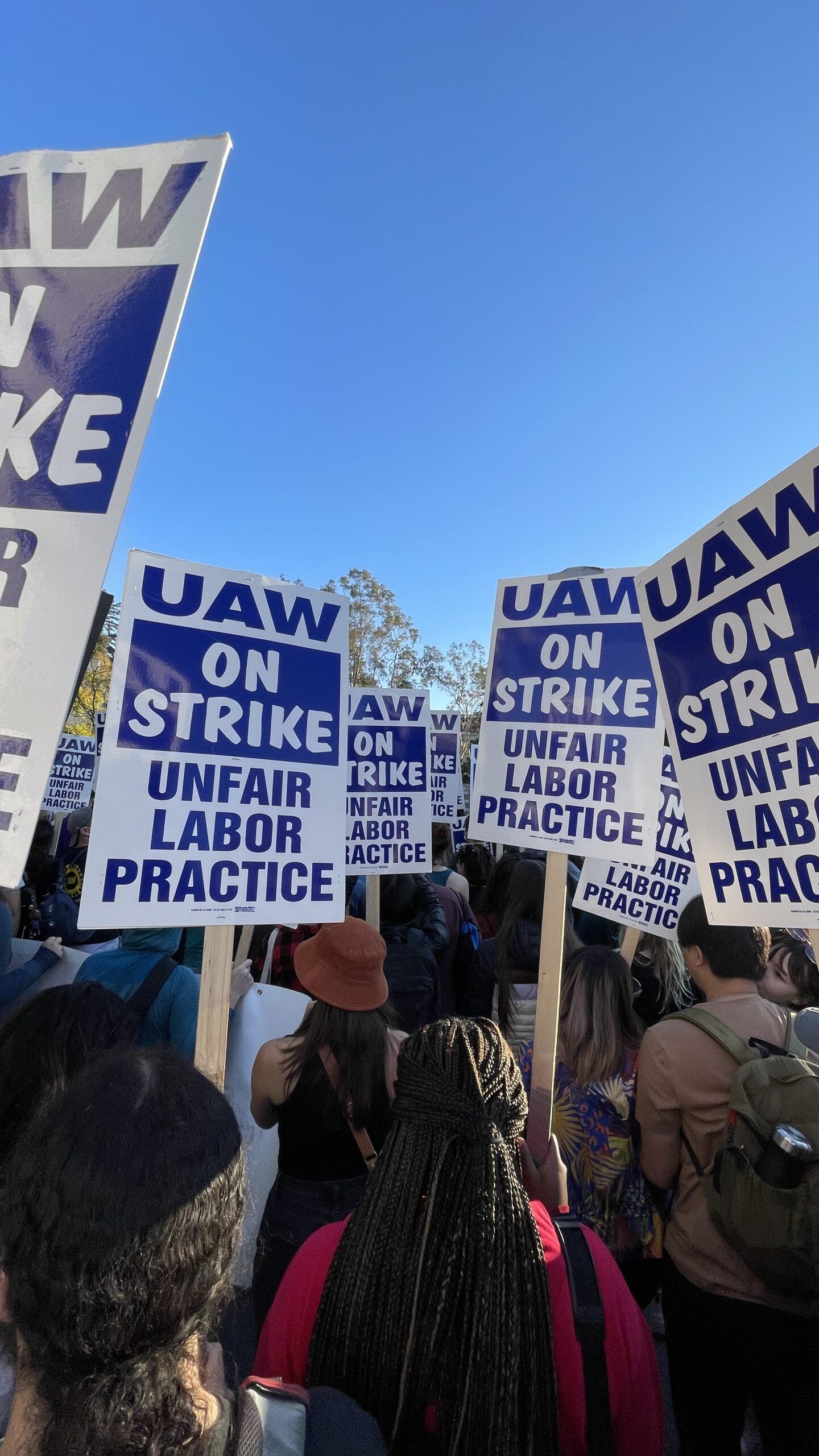 Photos of UAW academic workers on strike via Wikimedia Commons Pillsmarch, CC BY-SA 4.0
